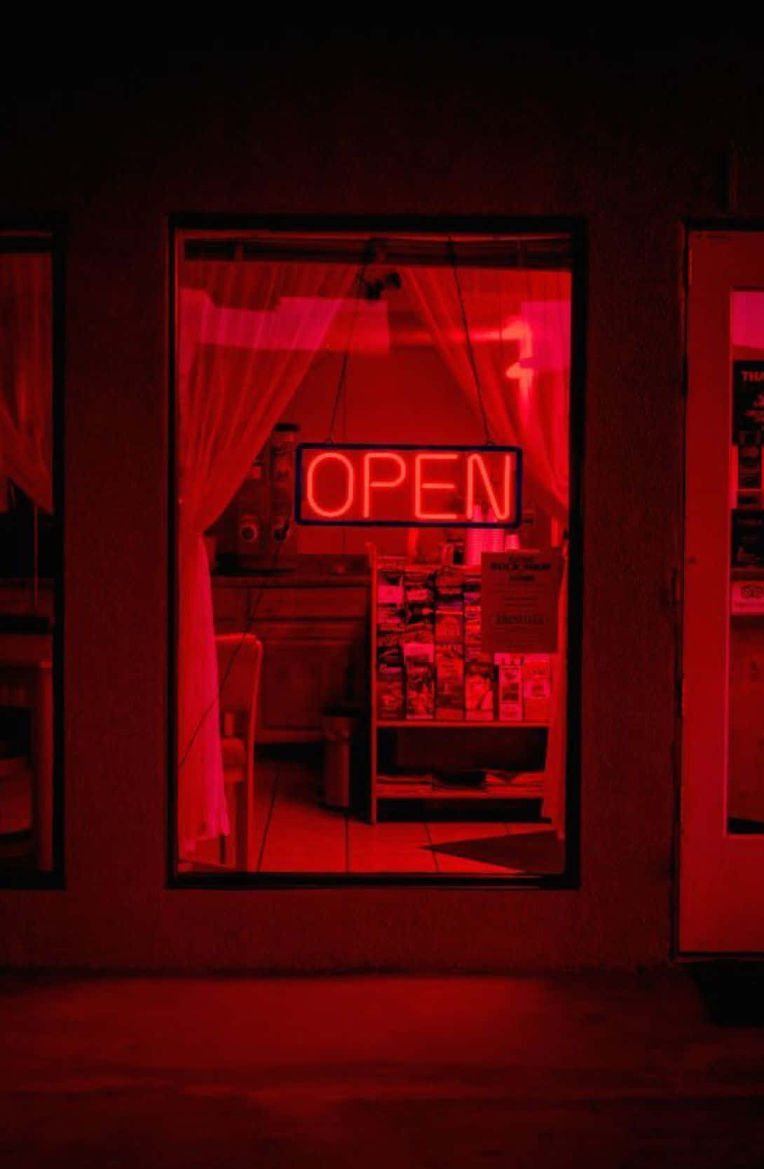 Ánh đèn neon đỏ rực rỡ thắp sáng màn đêm đầy cuốn hút Hình nền