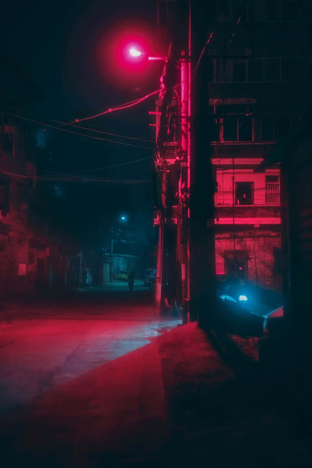 Ánh sáng thẩm mỹ đỏ neon chiếu sáng một con phố Hình nền