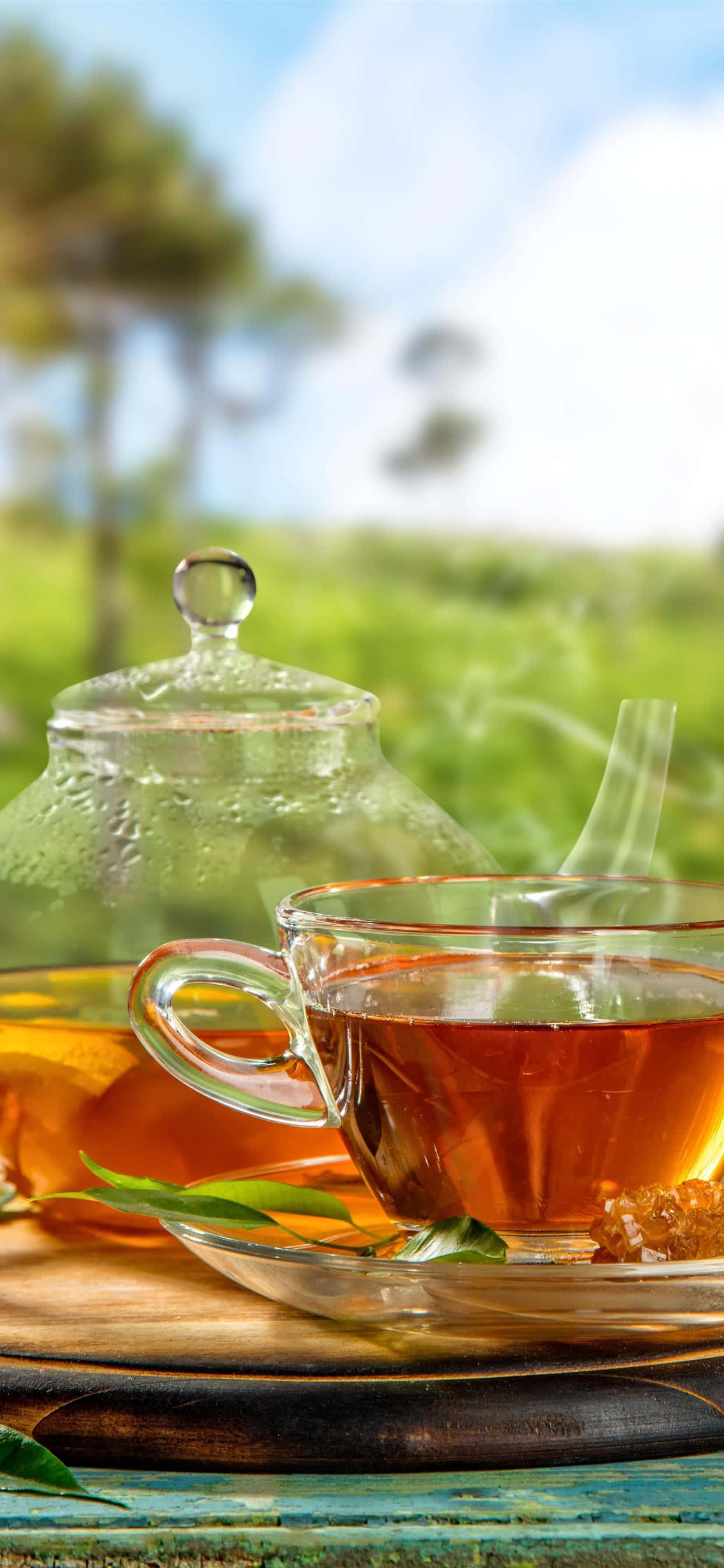 Ảnh tách trà thủy tinh và ấm đun nước Hình nền