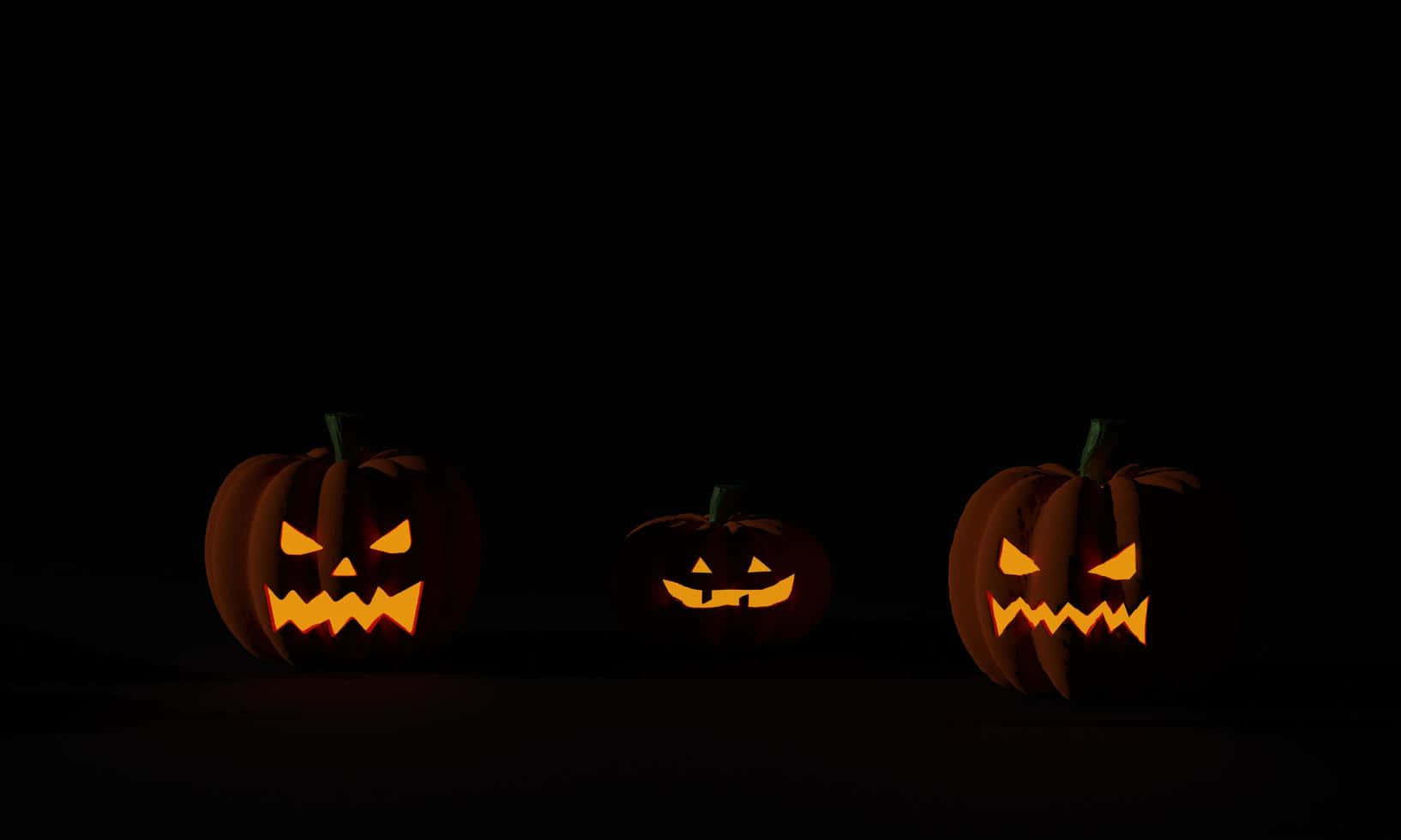 Ba quả bí ngô Halloween nền tối Hình nền