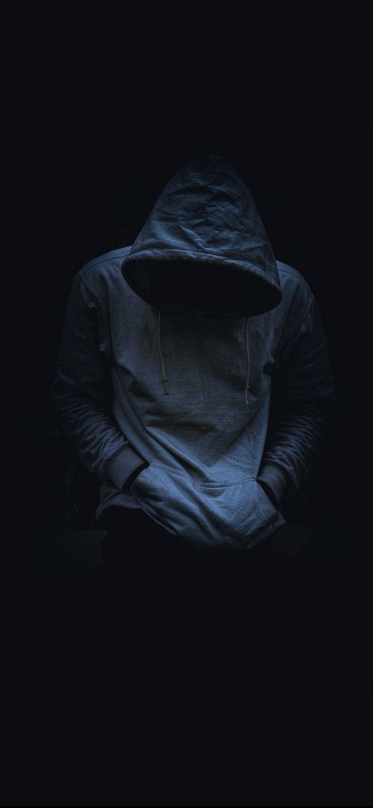 Chàng trai mặc áo hoodie cúi đầu Hình nền
