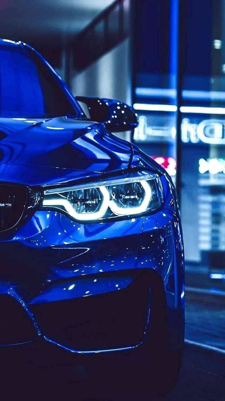 Đèn pha phát sáng của xe BMW màu xanh Hình nền
