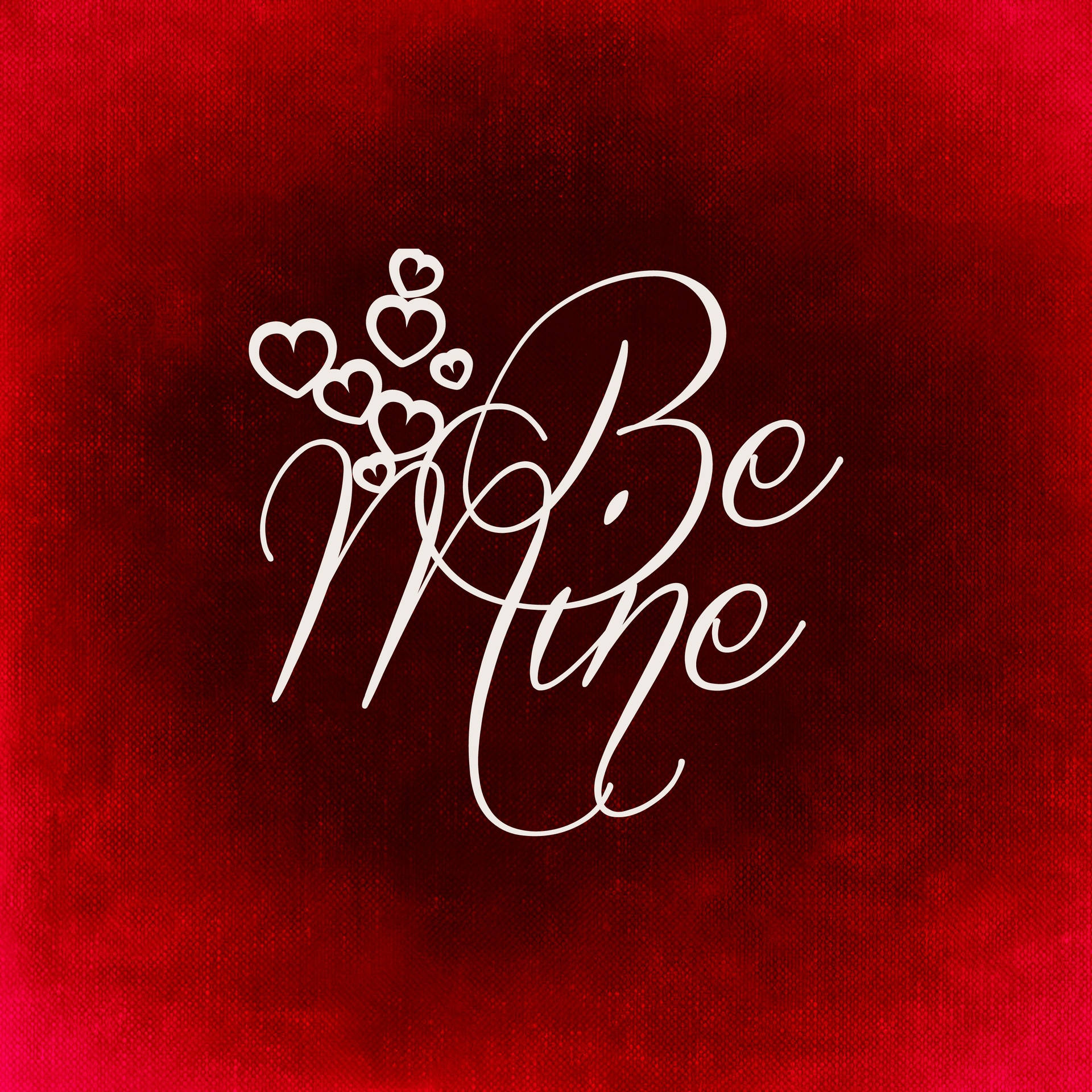 Dòng chữ cầu hôn "Be mine" viết màu trắng với những trái tim nhỏ dễ thương trên nền đỏ cho Ngày lễ Tình nhân.