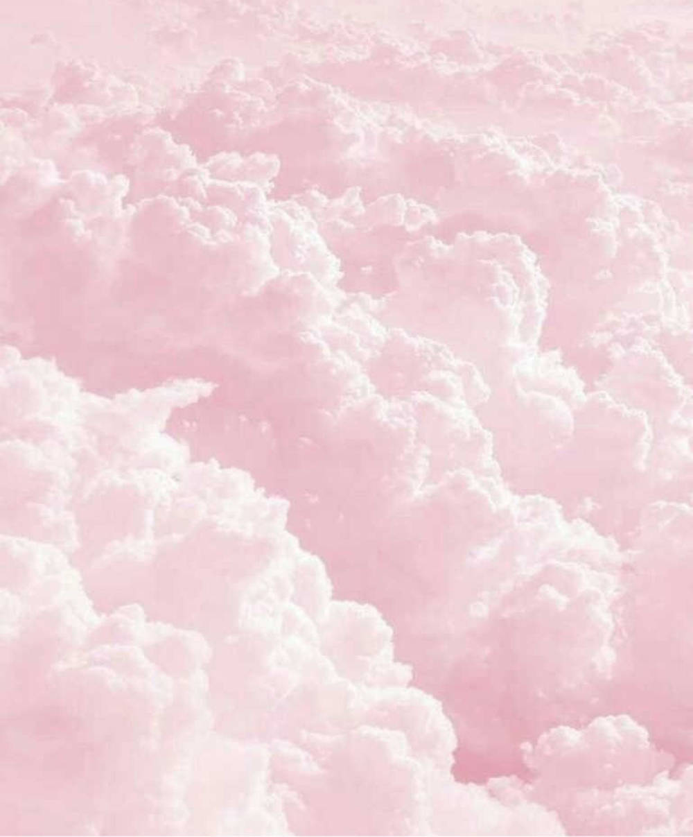 Hình nền iPad pastel mơ màng với những đám mây hồng dày Hình nền