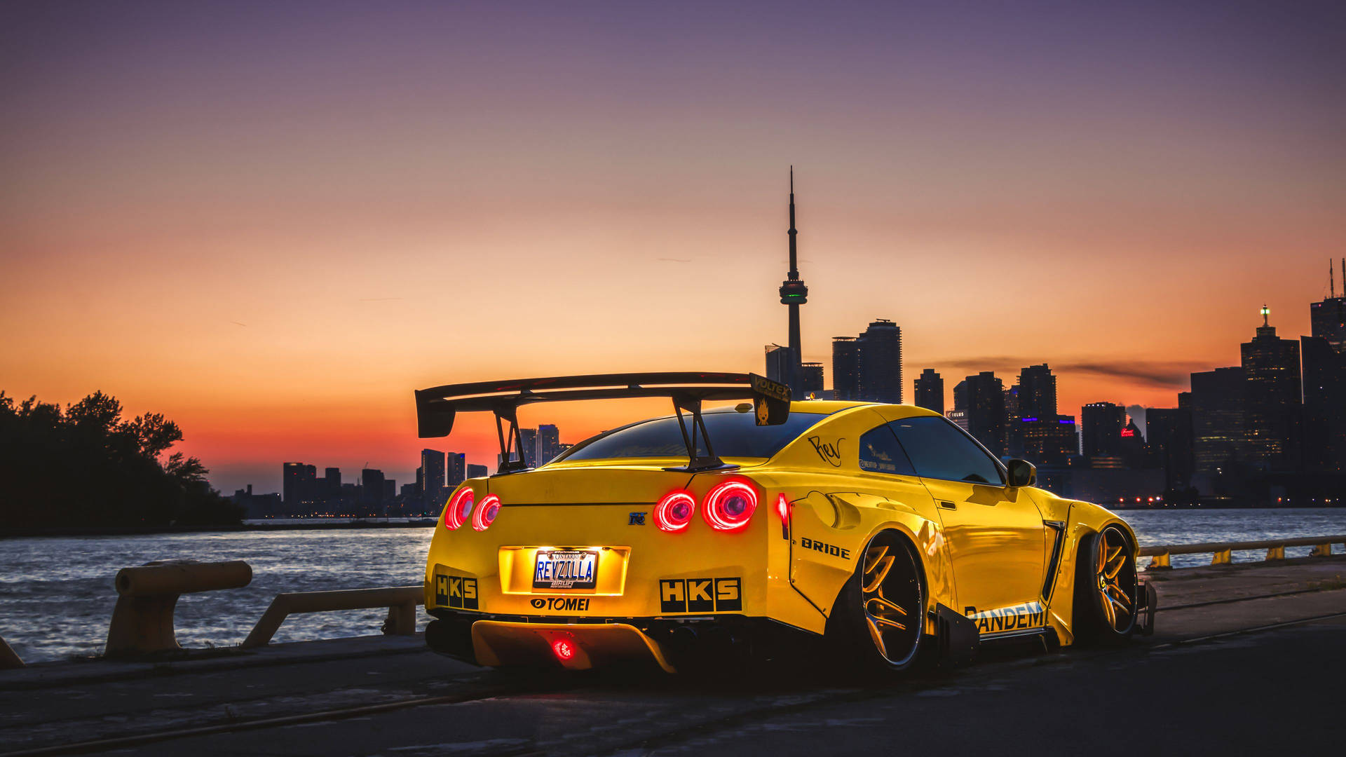 Revzilla HKS Nissan GT R màu vàng 4K — Xe hơi GIF Hình nền