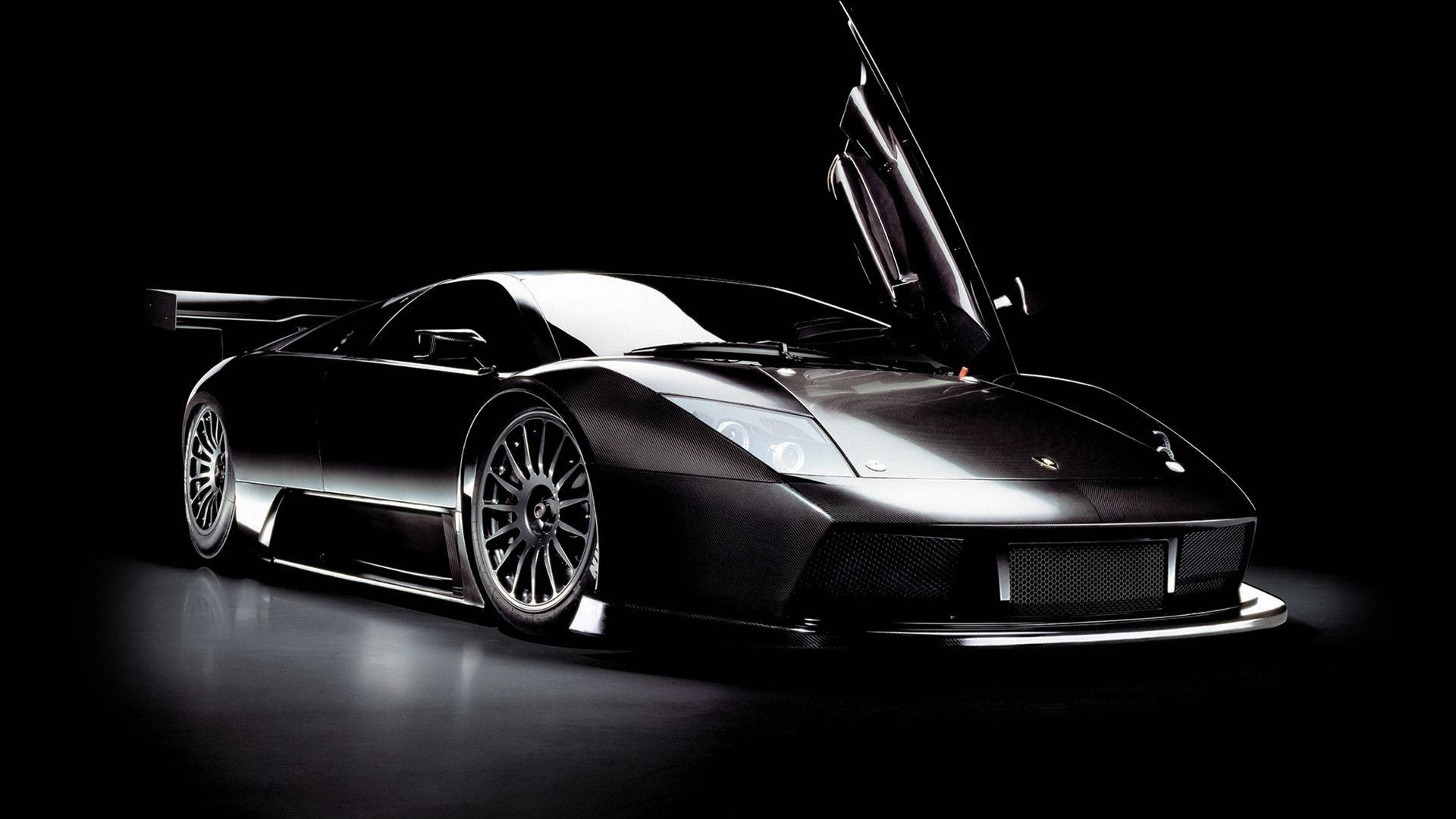 Hình nền xe hơi tuyệt đẹp Lamborghini đen với cửa cánh chim.