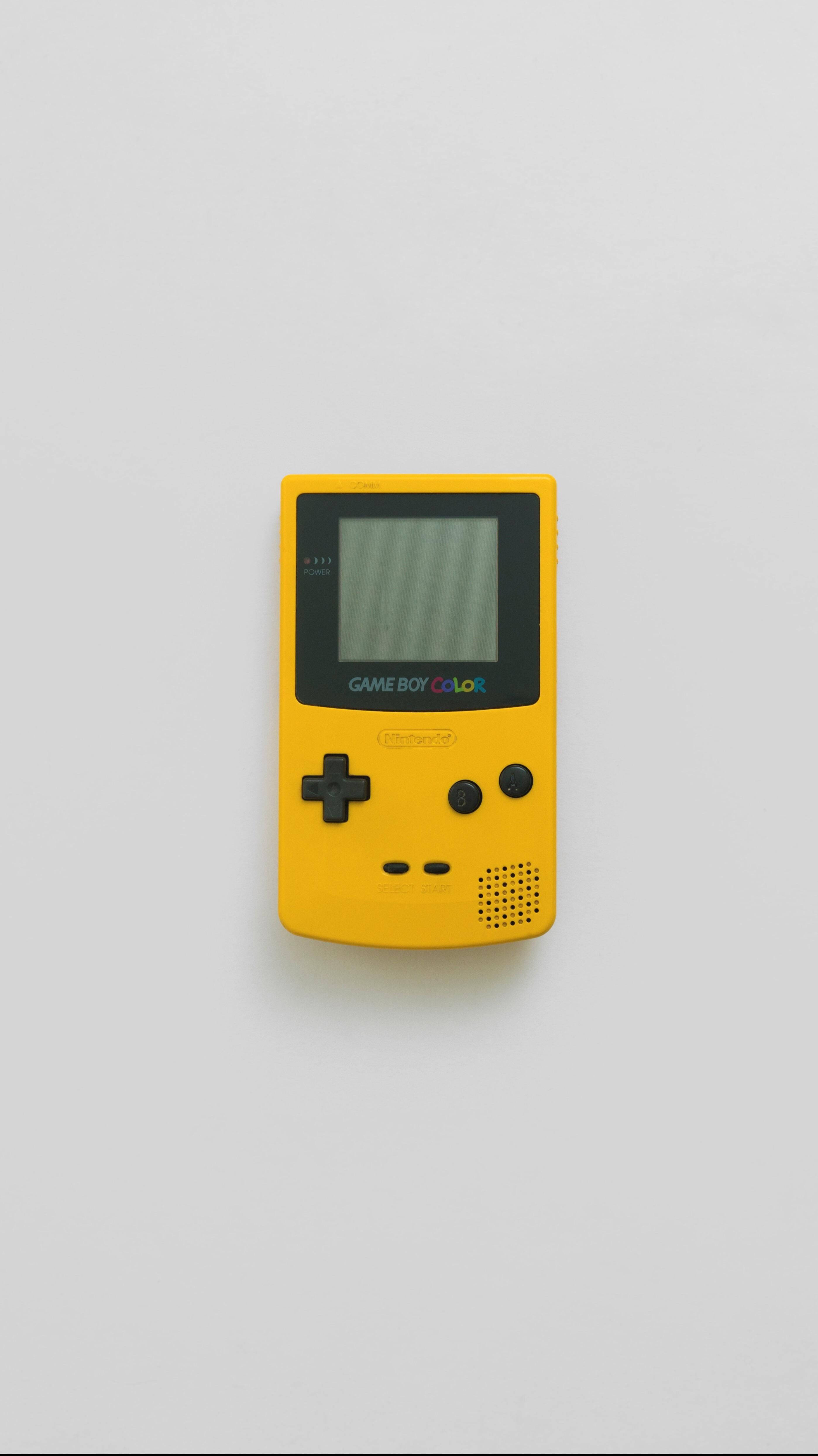 Máy chơi game Game Boy Color màu vàng đơn giản Hình nền