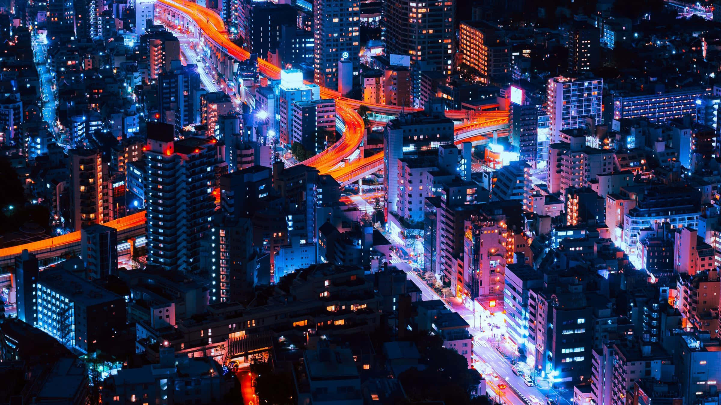 Một khung cảnh thành phố neon rực rỡ và tràn đầy năng lượng. Hình nền
