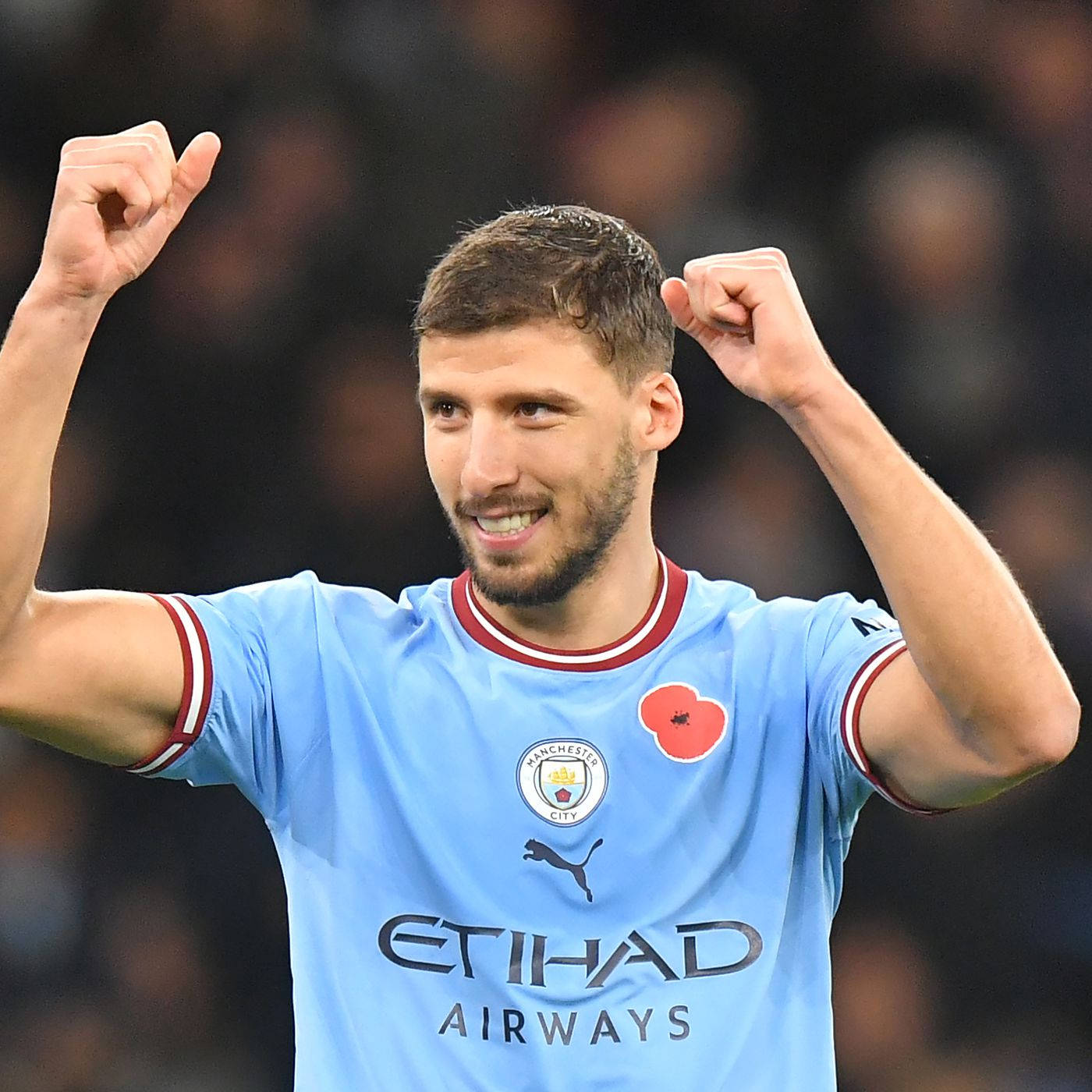 Ruben Dias giơ cả hai nắm đấm Hình nền