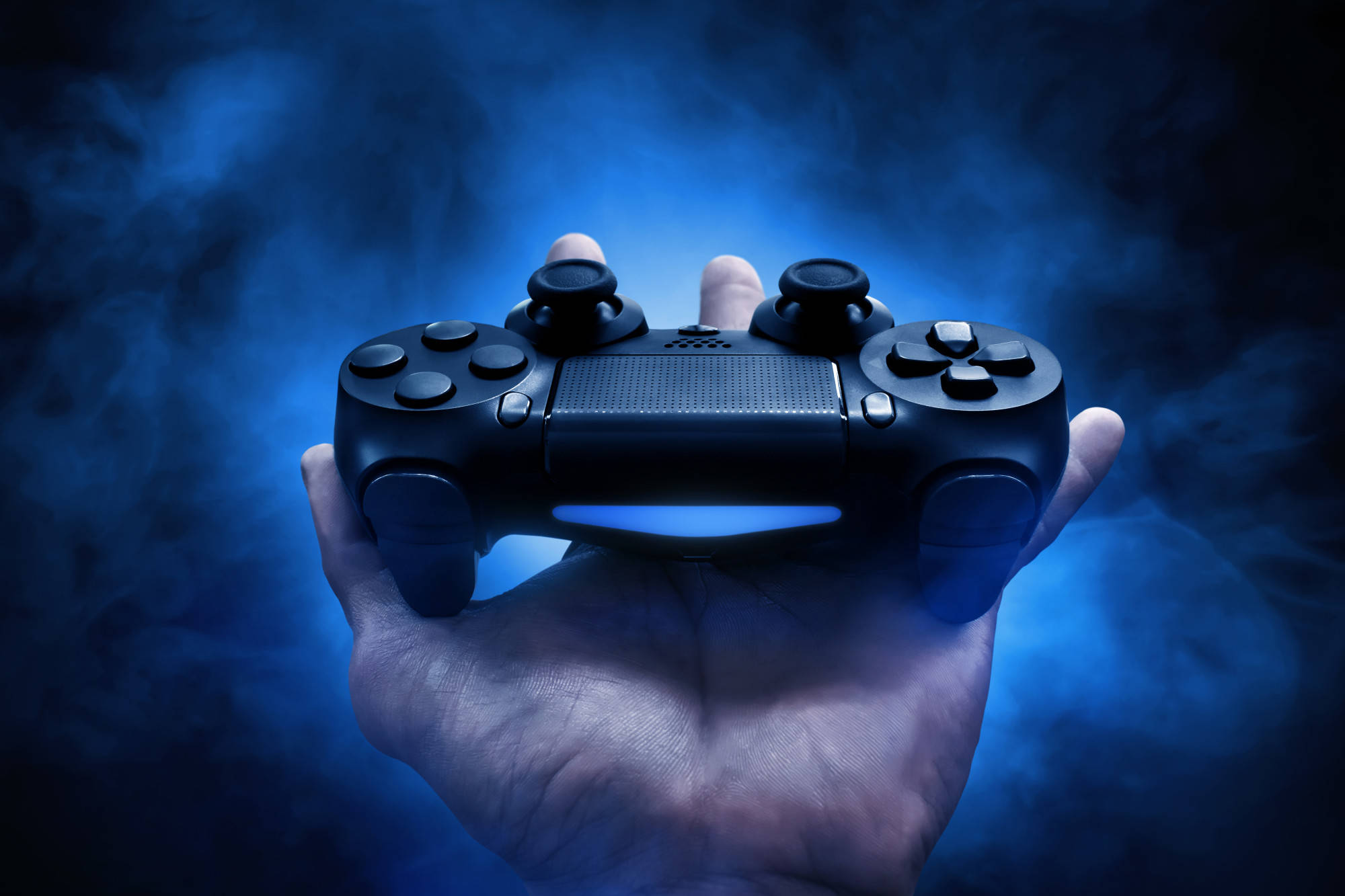Tay cầm chơi game trên tay Hình nền