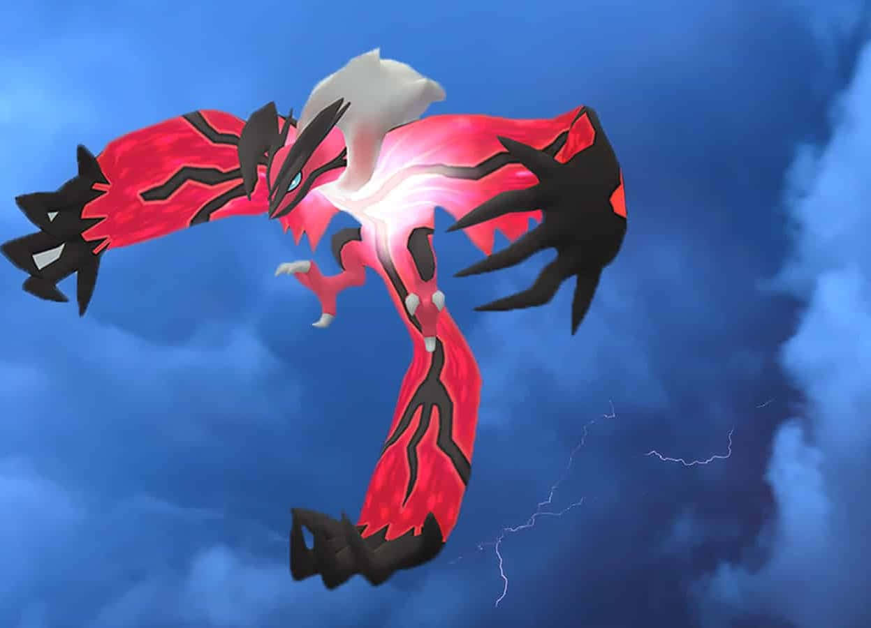 Yveltal Pokémon phát sáng trên bầu trời Hình nền
