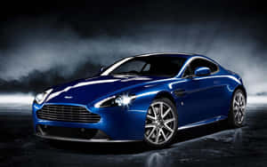 Aston Martin DB9 ấn tượng đang chuyển động trên cung đường đẹp — Steam Deck OLED Hình nền