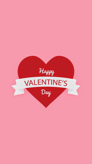 Trái tim đỏ lớn với dòng chữ "Chúc mừng Ngày Valentine" ở giữa trên nền hồng.