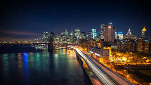 Hình nền cảnh thành phố New York với ánh đèn rực rỡ.