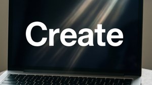 Hình nền MacBook tối giản với từ 'Create' in đậm.